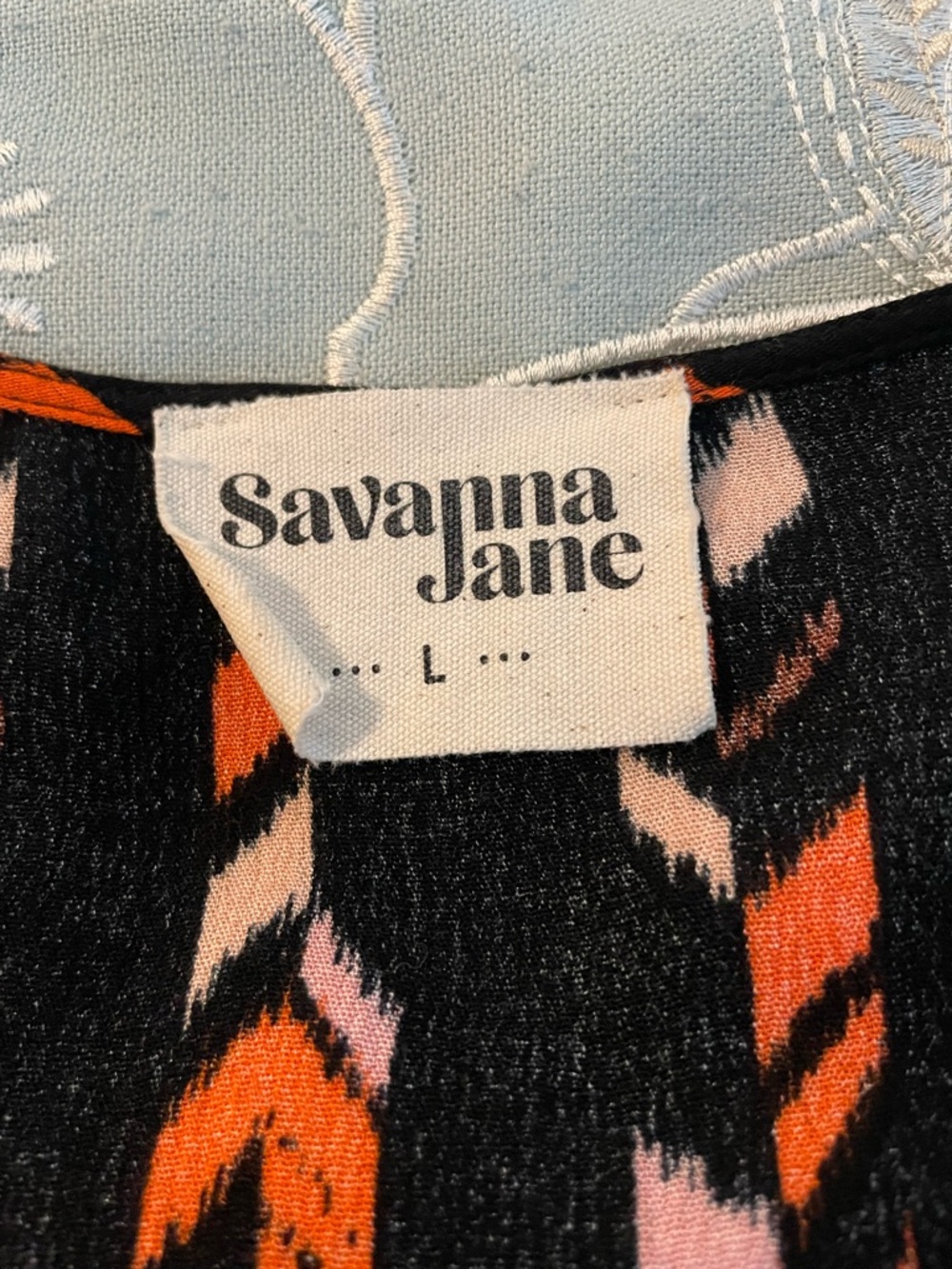 Savanna Jane Black Top with Bright Orange and Soft Pink Floral & Chevron Detail - Picture 9 of 10
